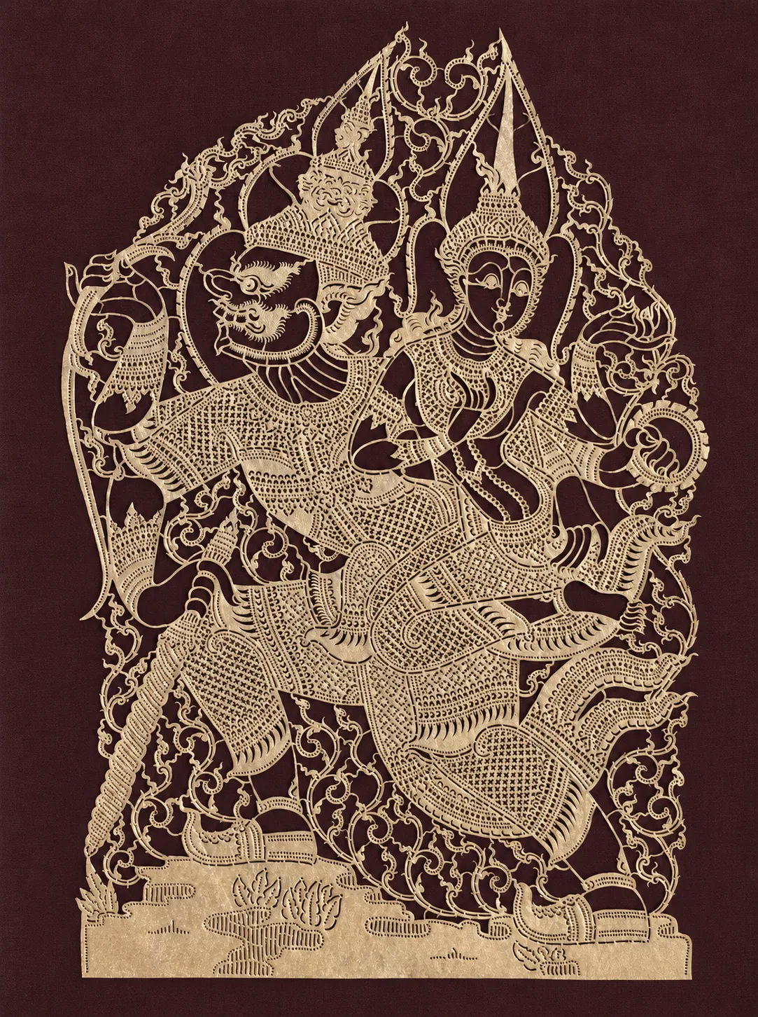 Gold cut leather on maroon: a Ramayana scene, carved by hand
