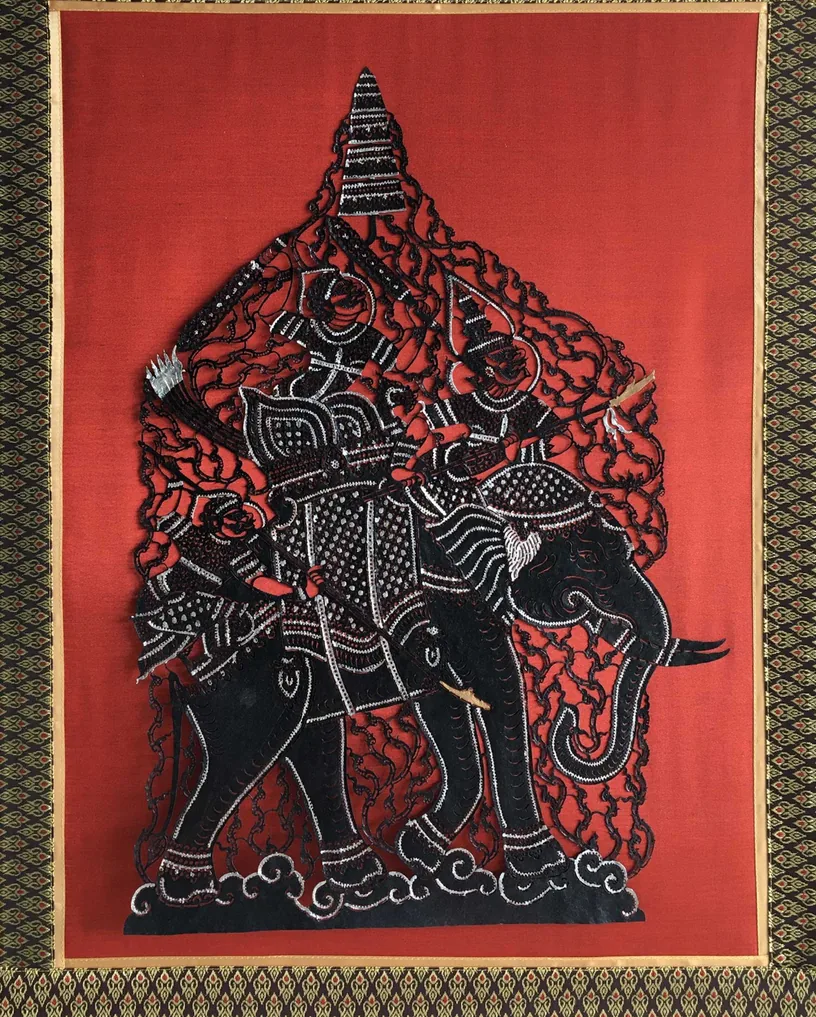 Ramayana, Chapter 1: a black cut-leather warrior on an elephant, on red
